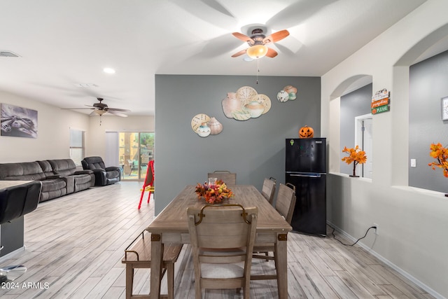 dining room featuring light wood-type flooring and ceiling fan