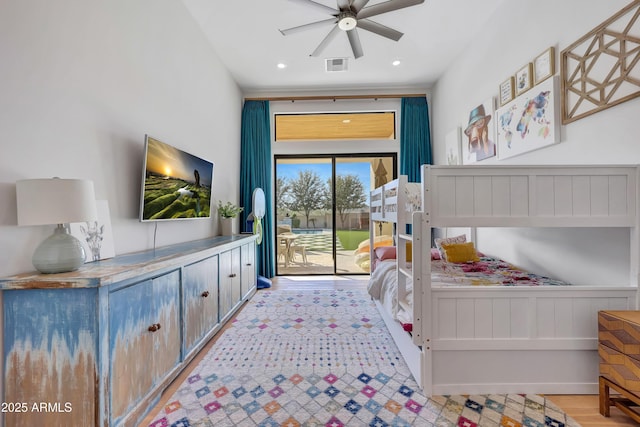 bedroom featuring access to exterior and light hardwood / wood-style floors