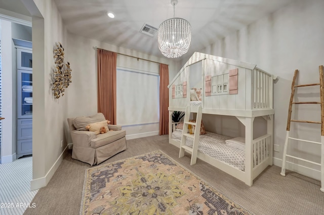 bedroom featuring a chandelier and carpet