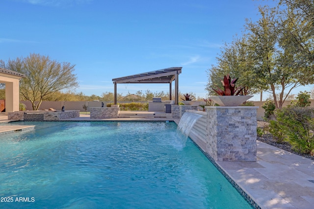 view of swimming pool with area for grilling, a patio area, and pool water feature