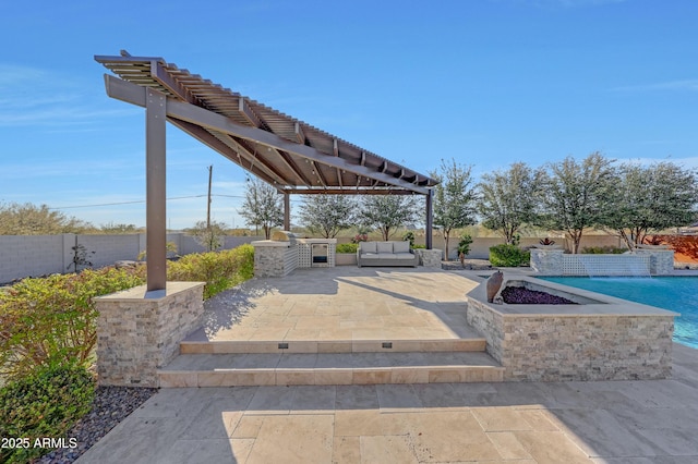 view of patio with an outdoor living space and exterior kitchen