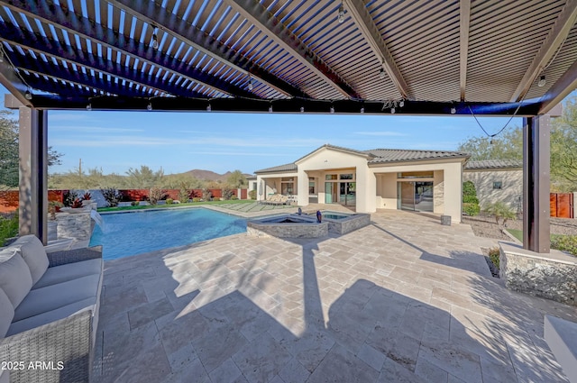 view of pool with outdoor lounge area, an in ground hot tub, a pergola, a mountain view, and a patio area