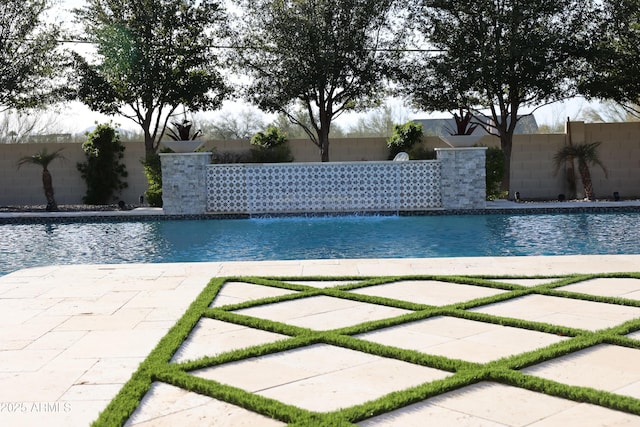 view of pool with pool water feature