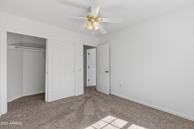 unfurnished bedroom with a closet, baseboards, and carpet floors