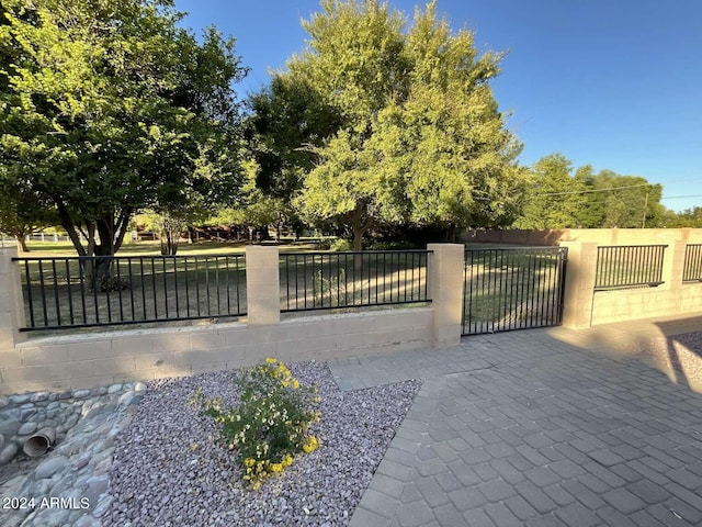 view of gate featuring fence