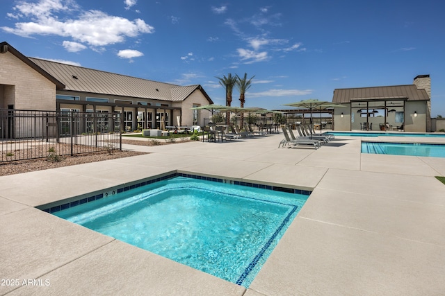 view of swimming pool with a patio area