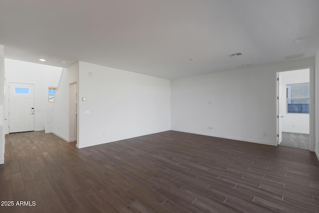 unfurnished room featuring dark hardwood / wood-style flooring