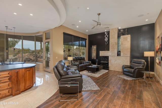 living room with hardwood / wood-style flooring and ceiling fan