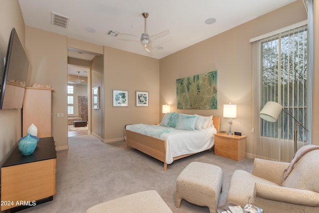 bedroom featuring ceiling fan and light colored carpet