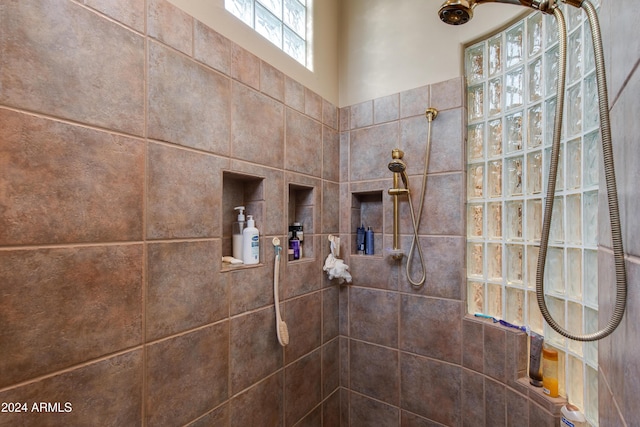 bathroom with tiled shower