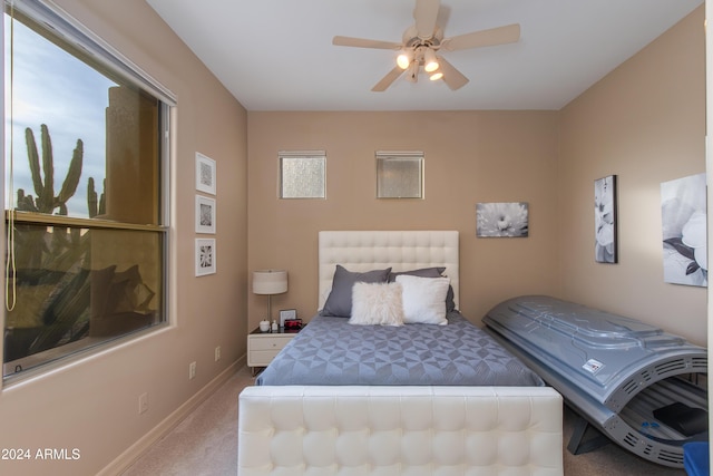 carpeted bedroom with ceiling fan