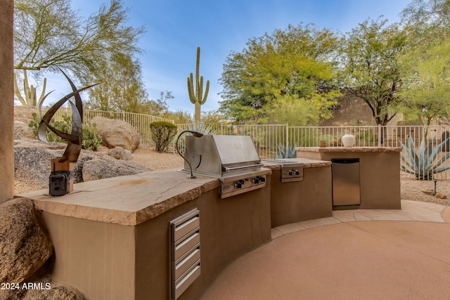 view of patio with a grill and exterior kitchen