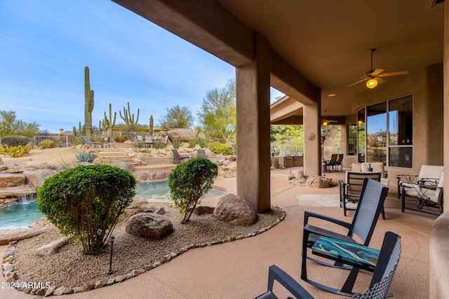 view of patio featuring ceiling fan