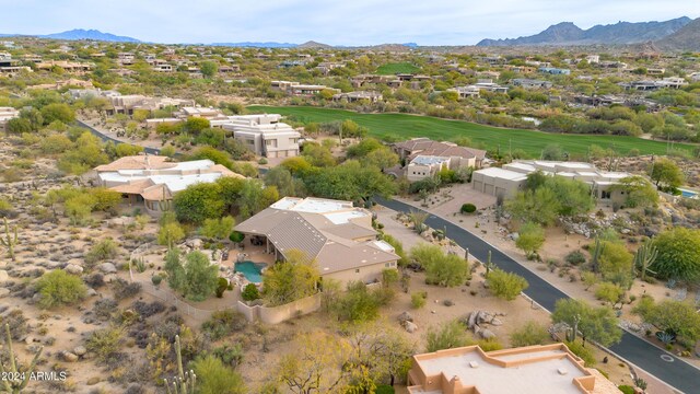 birds eye view of property with a mountain view