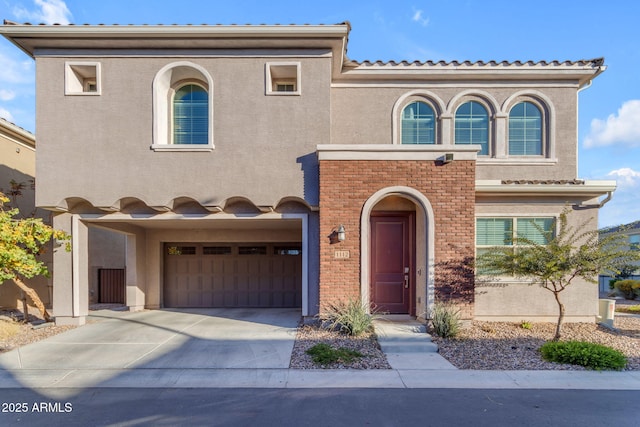 mediterranean / spanish-style house featuring a garage