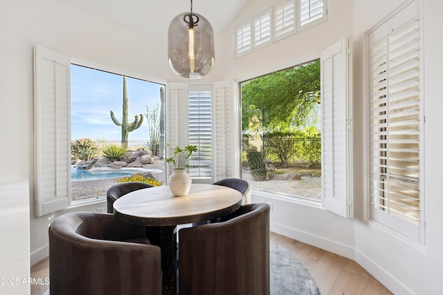 10875 E Mirasol Cir, Scottsdale, AZ 85255 - dining room with baseboards, light wood finished floors, and a high ceiling