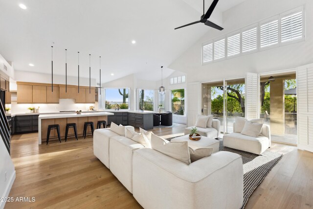 10875 E Mirasol Cir, Scottsdale, AZ 85255 - living room featuring recessed lighting, a ceiling fan, light wood finished floors, and high vaulted ceiling