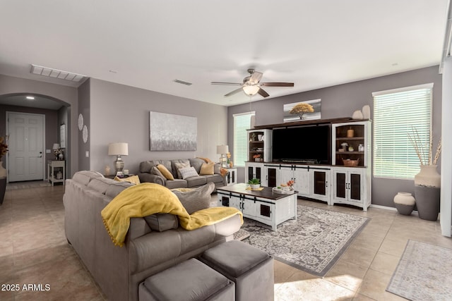 living room with light tile patterned floors and ceiling fan