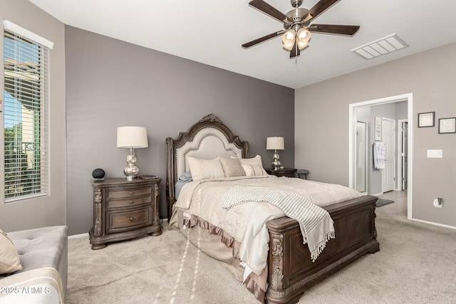 bedroom with light carpet and ceiling fan