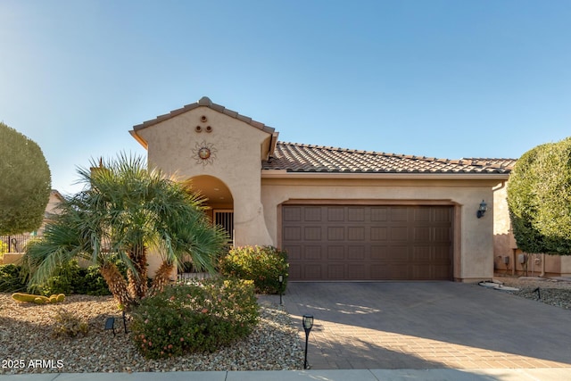 mediterranean / spanish-style house featuring a garage