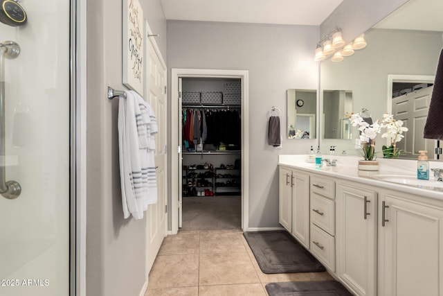 bathroom with vanity, tile patterned floors, and a shower with shower door