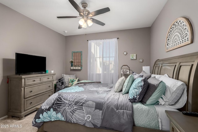 bedroom with light colored carpet and ceiling fan