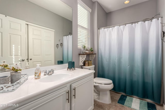 bathroom with vanity and toilet