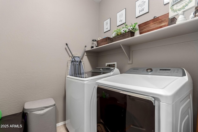 washroom with washer and dryer