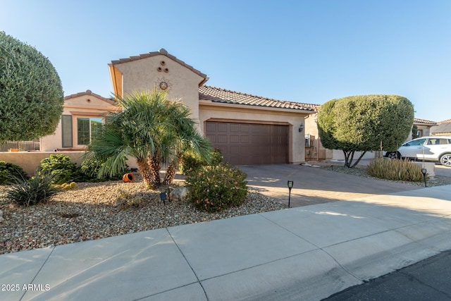 mediterranean / spanish-style home featuring a garage