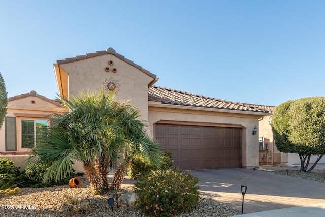 mediterranean / spanish-style home featuring a garage