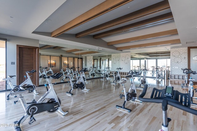 workout area with light hardwood / wood-style floors