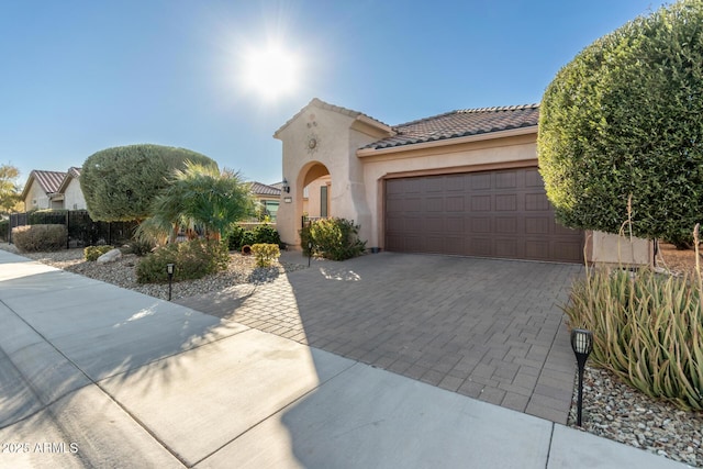 view of front of property with a garage