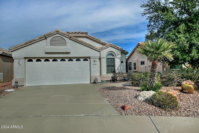 view of front of property featuring a garage