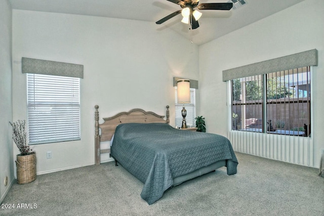 bedroom with ceiling fan, light carpet, and vaulted ceiling