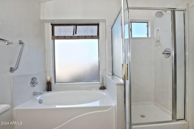 bathroom with separate shower and tub