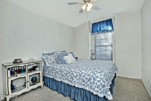 carpeted bedroom featuring ceiling fan and vaulted ceiling