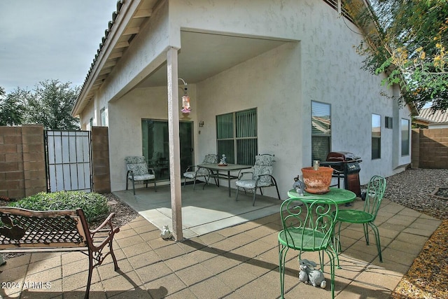 rear view of house with a patio