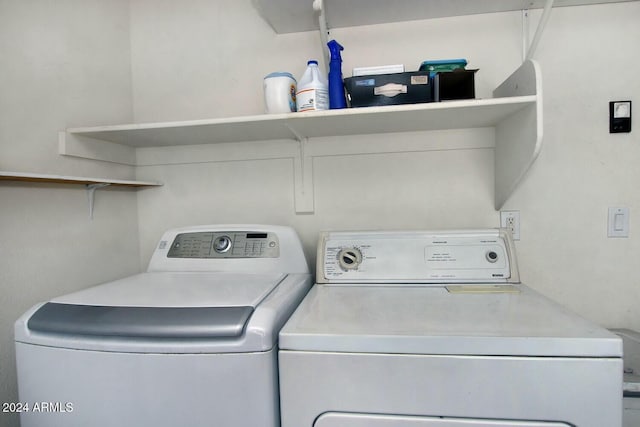 washroom with washer and dryer