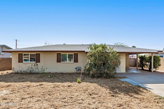 ranch-style house with a carport