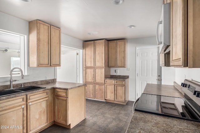 kitchen featuring sink and black range oven