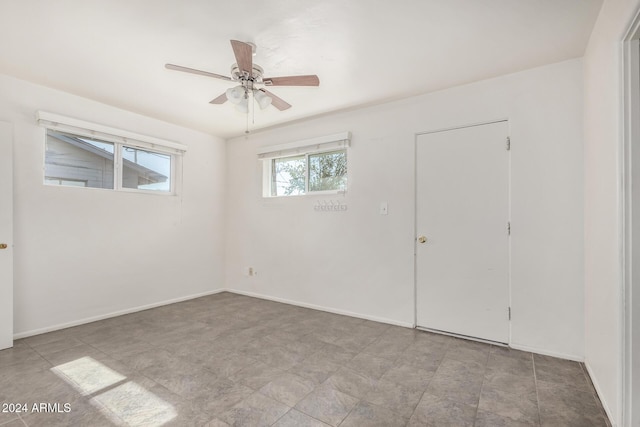 empty room featuring ceiling fan