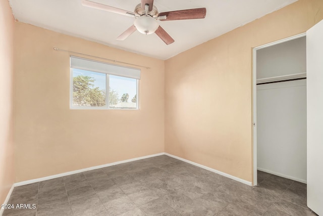 unfurnished bedroom featuring a closet and ceiling fan