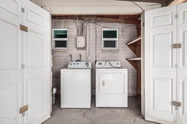 laundry area with independent washer and dryer