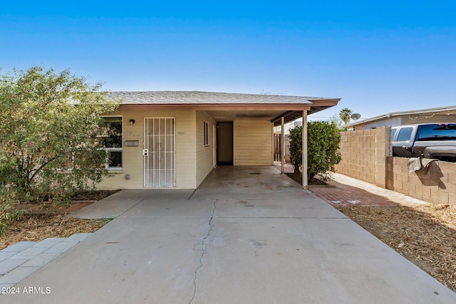 view of front of home with a carport