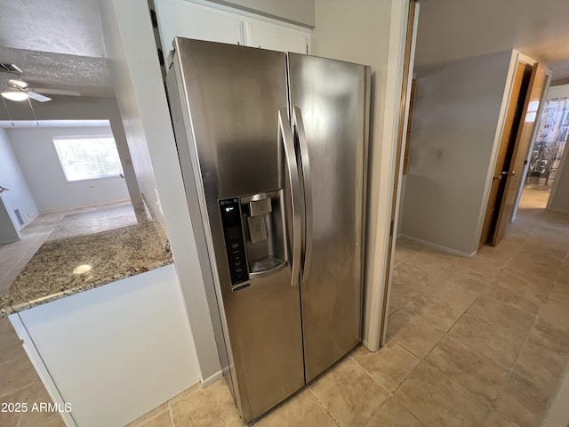 5342 E Des Moines St, Mesa, AZ 85205 - kitchen with stainless steel refrigerator with ice dispenser, white cabinetry, ceiling fan, light stone countertops, and light tile patterned flooring