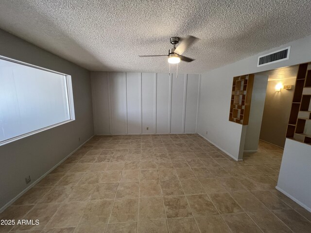 5342 E Des Moines St, Mesa, AZ 85205 - tiled spare room with a ceiling fan and a textured ceiling