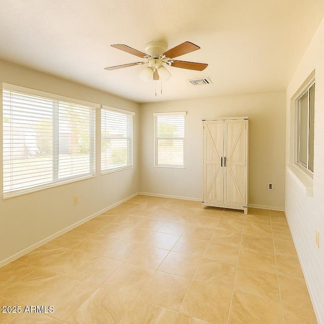 5342 E Des Moines St, Mesa, AZ 85205 - spare room with ceiling fan, light tile patterned floors, and baseboards
