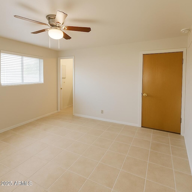5342 E Des Moines St, Mesa, AZ 85205 - spare room featuring a ceiling fan, light tile patterned flooring, and baseboards