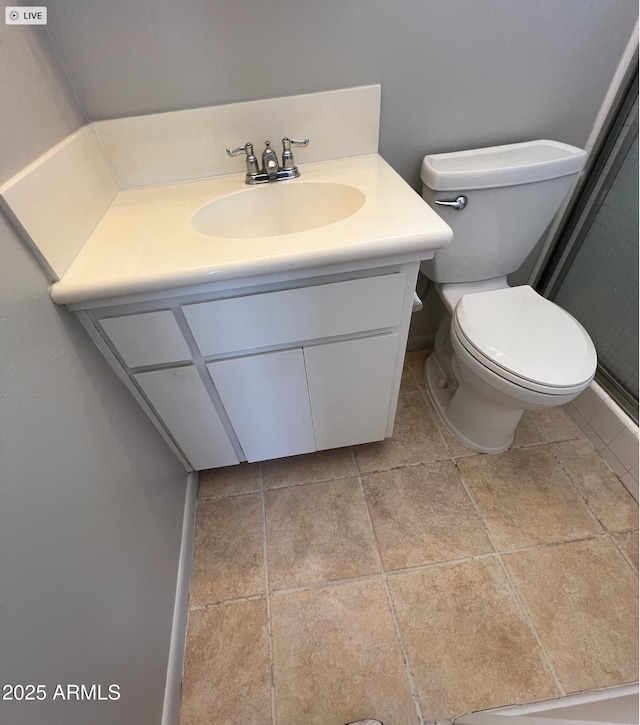 5342 E Des Moines St, Mesa, AZ 85205 - bathroom featuring vanity, toilet, tile patterned floors, and baseboards
