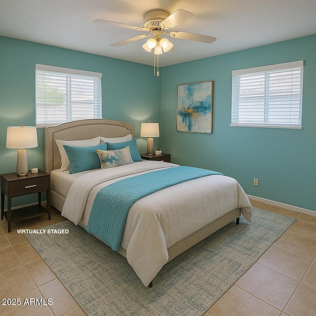 5342 E Des Moines St, Mesa, AZ 85205 - tiled bedroom featuring multiple windows, a ceiling fan, and baseboards